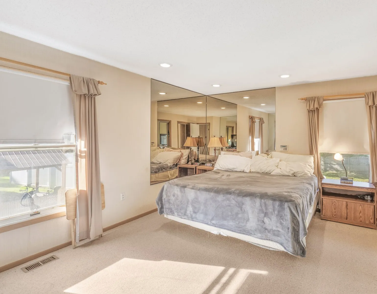Bedroom with a made bed and soft natural light