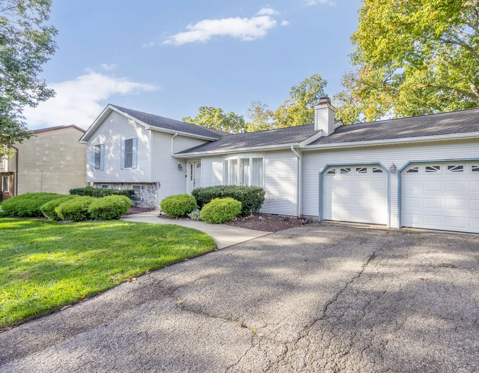 Front of the home with a two-car attached garage and driveway